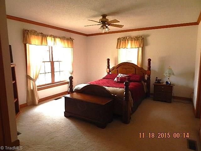 1077 Slate Road King, NC 27021 - Photo 9 of 30 Spacious master bedroom.