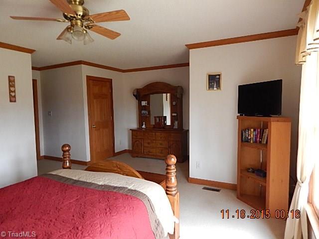 1077 Slate Road King, NC 27021 - Photo 10 of 30 The master bedroom has two walk-in closets.