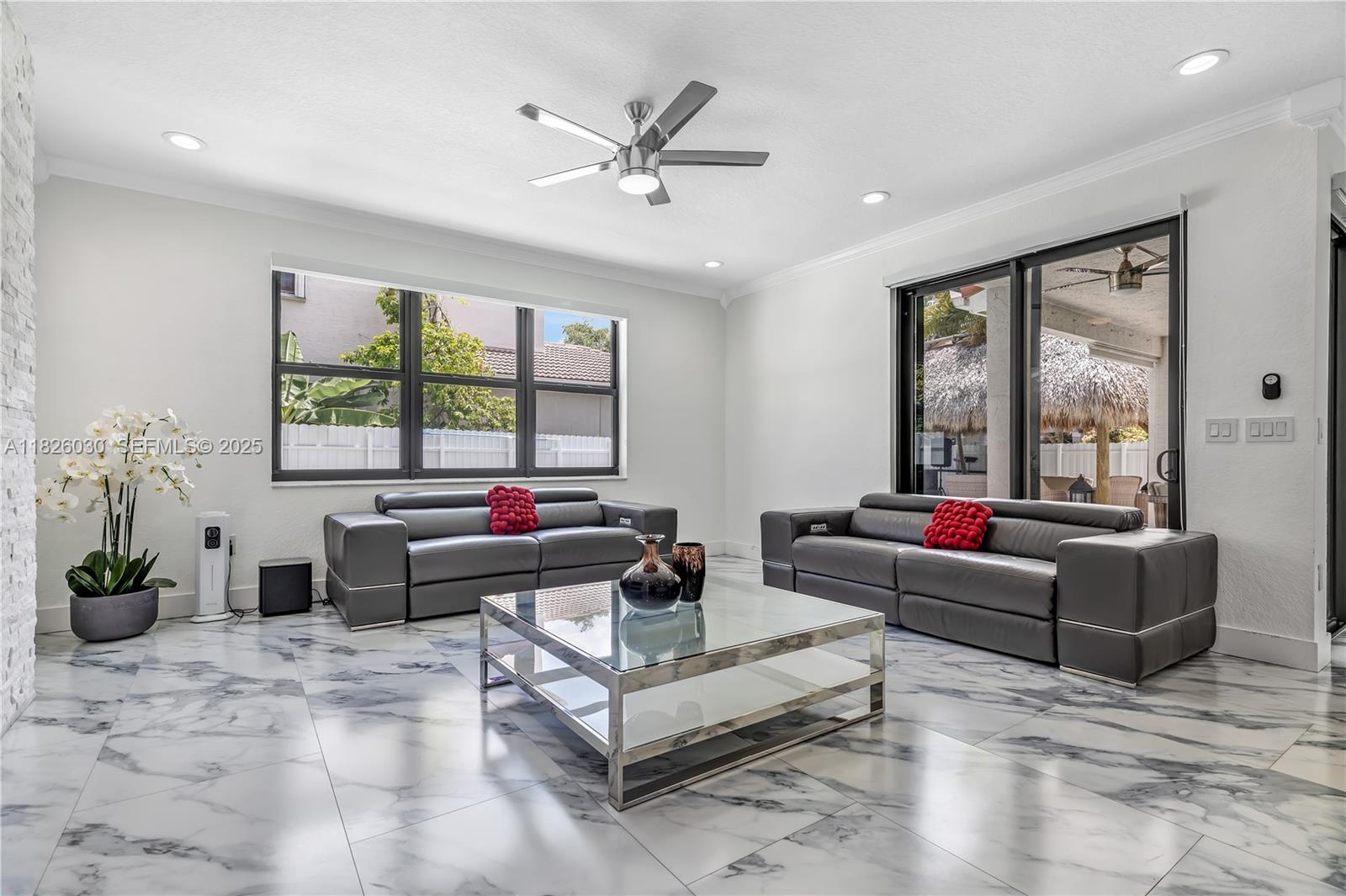 16488 Southwest 30th Street Miramar, FL 33027 - Photo 12 of 50 a living room with furniture and a large window