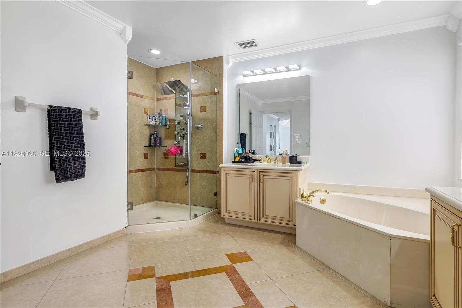 16488 Southwest 30th Street Miramar, FL 33027 - Photo 23 of 50 a bathroom with a tub a sink and a mirror