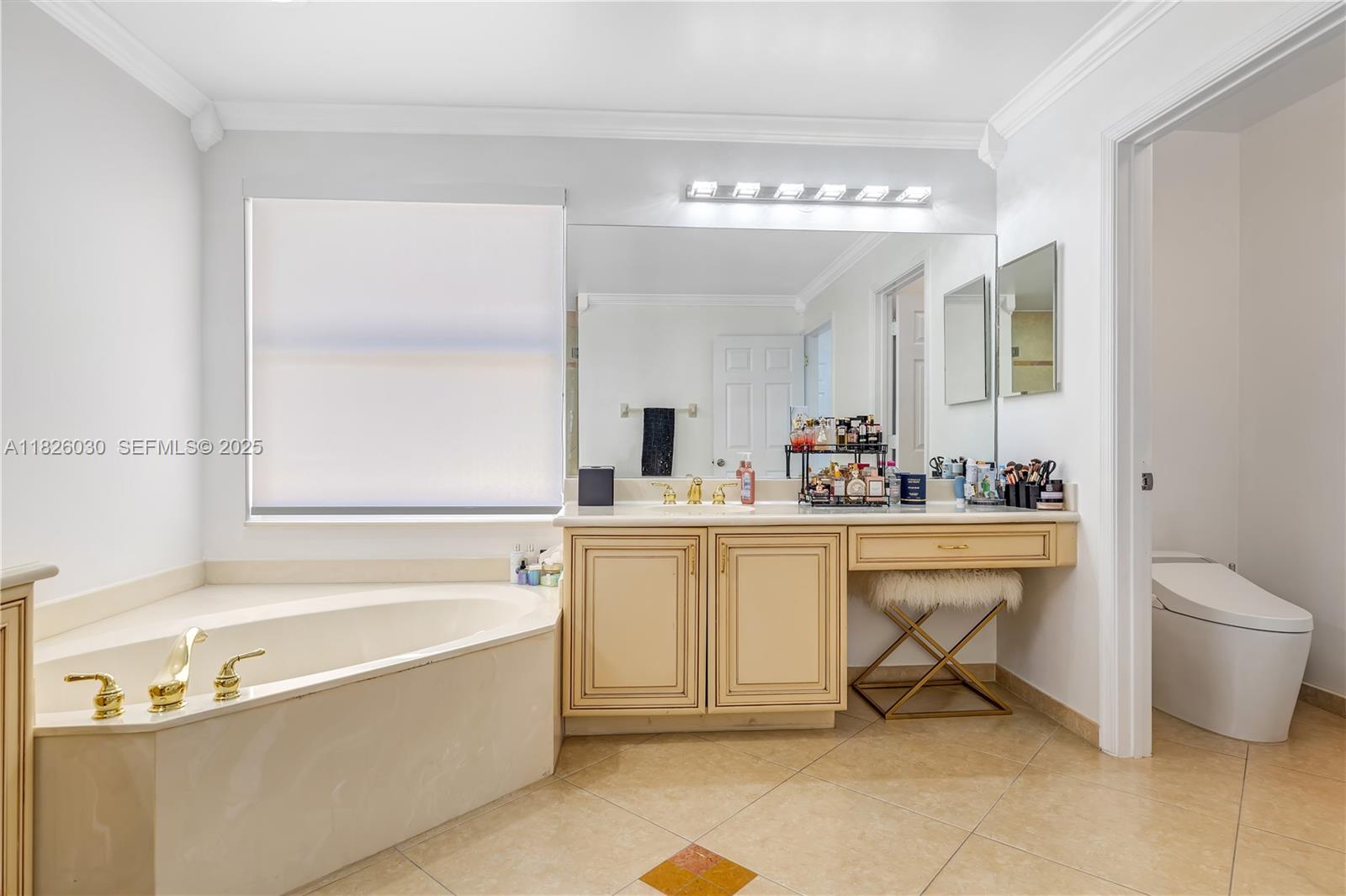 16488 Southwest 30th Street Miramar, FL 33027 - Photo 24 of 50 a spacious bathroom with a tub sink and mirror