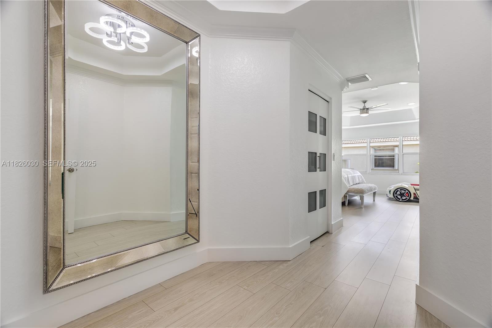 16488 Southwest 30th Street Miramar, FL 33027 - Photo 27 of 50 a very nice looking room with wooden floor and a bathroom