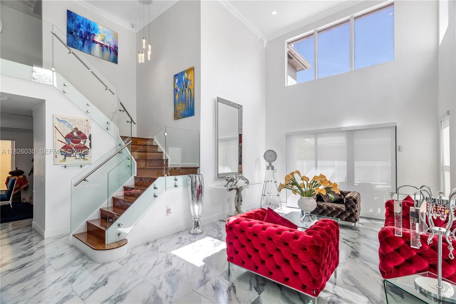 16488 Southwest 30th Street Miramar, FL 33027 - Photo 34 of 50 a living room with furniture toys and a large window