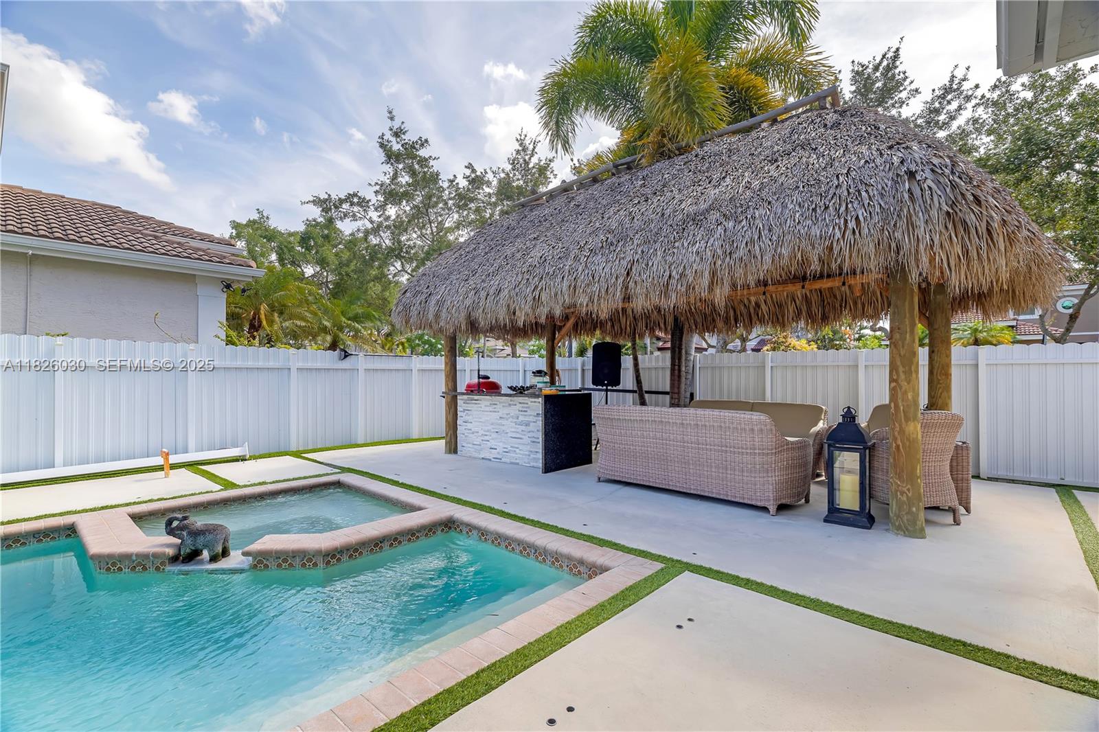 16488 Southwest 30th Street Miramar, FL 33027 - Photo 35 of 50 a view of a backyard with a sitting area