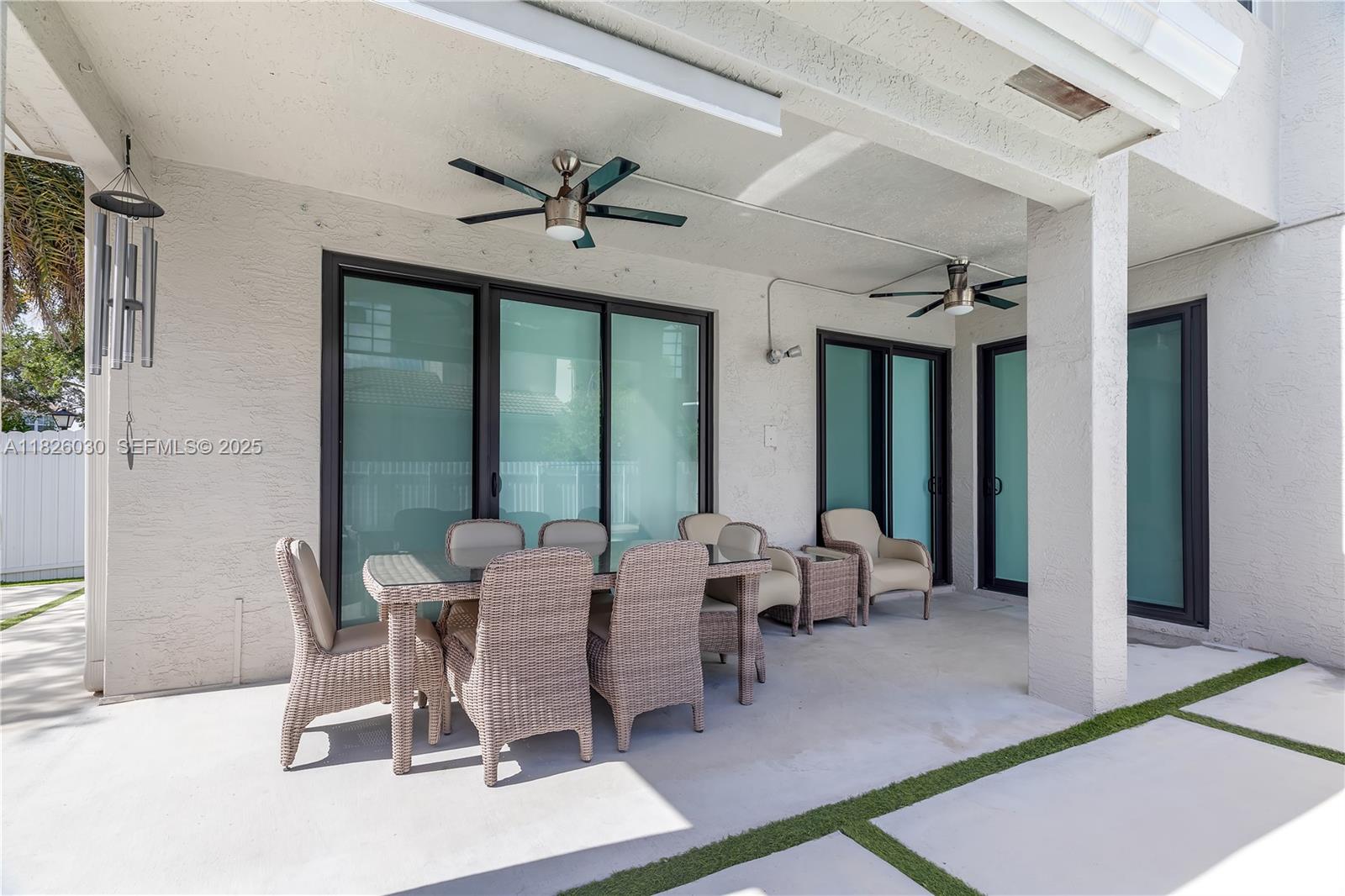16488 Southwest 30th Street Miramar, FL 33027 - Photo 41 of 50 a dining room with furniture water view and a floor to ceiling window
