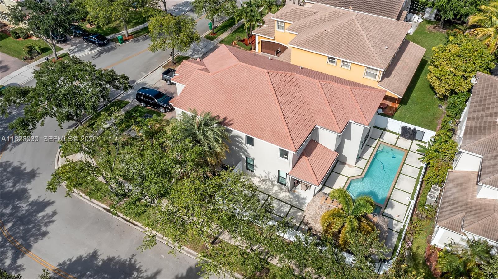 16488 Southwest 30th Street Miramar, FL 33027 - Photo 48 of 50 an aerial view of a house with a yard and lake view