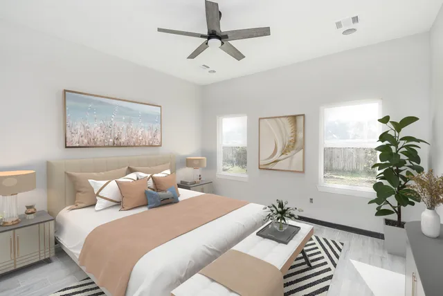 a bedroom with a bed and a chandelier