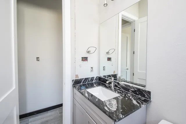 a bathroom with a sink and a mirror