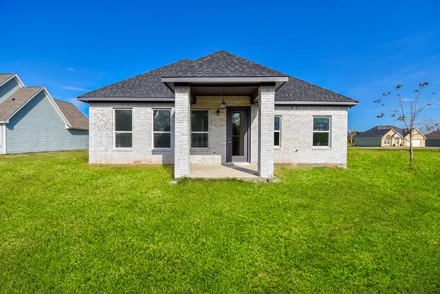 a front view of a house with yard