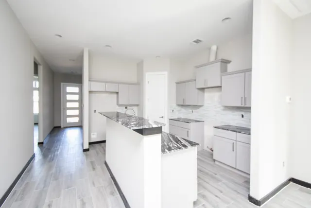 a large kitchen with a lot of counter space