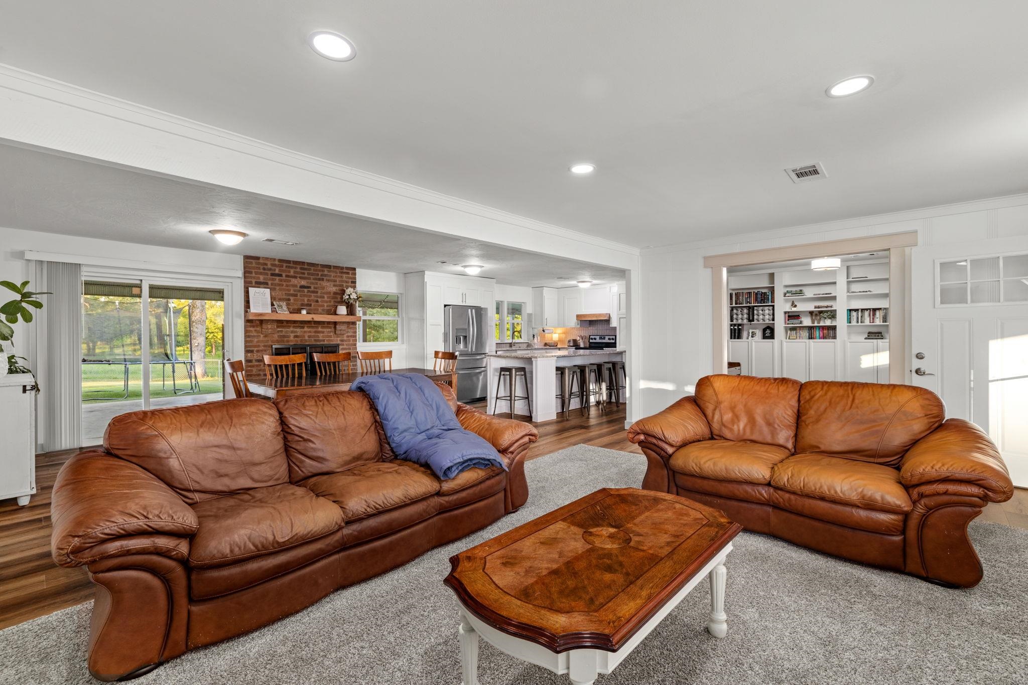 66 County Road 511 Corinth, MS 38834 - Photo 6 of 40 Open-concept living space featuring wood-finish flooring, recessed lighting, and white trim