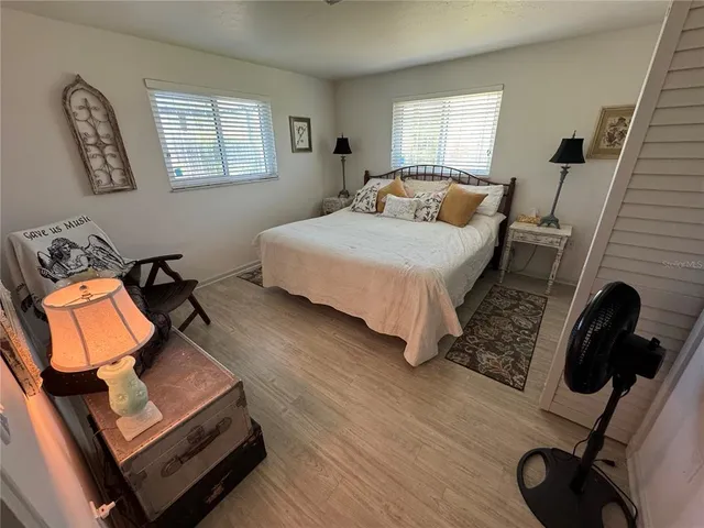 a bathroom with a sink mirror and toilet