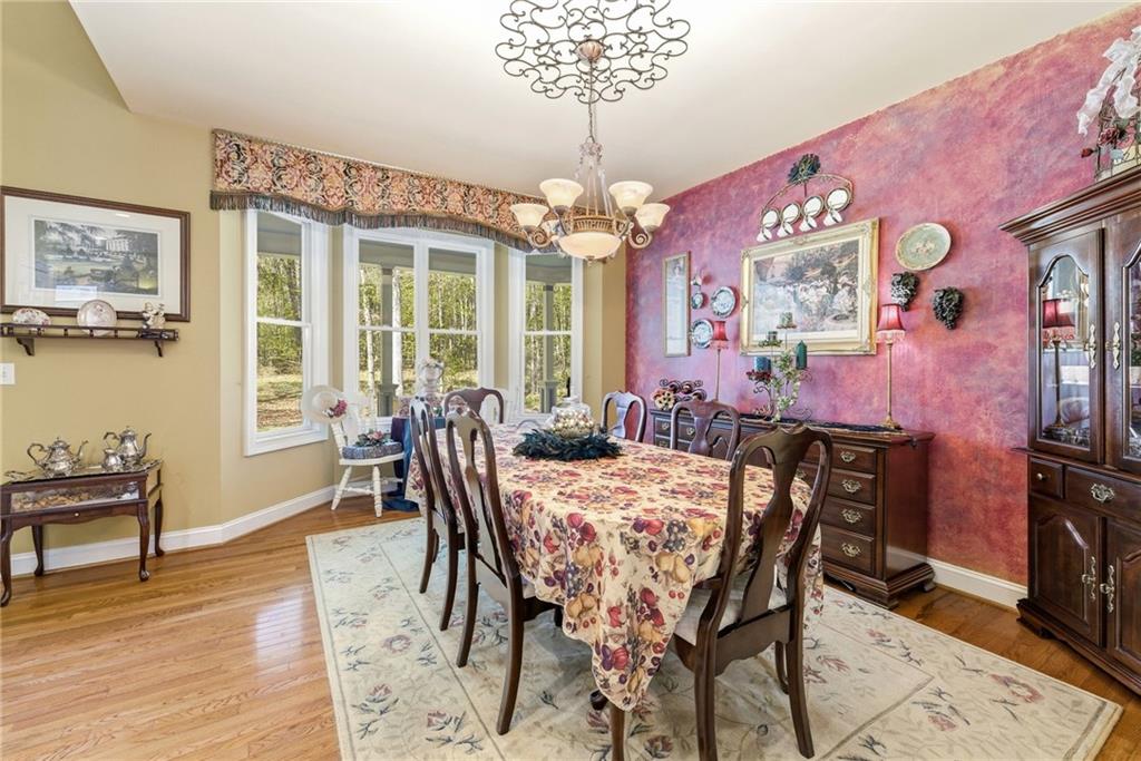 4829 Old Pendergrass Road Jefferson, GA 30549 - Photo 11 of 55 a view of a dining room with furniture window and wooden floor