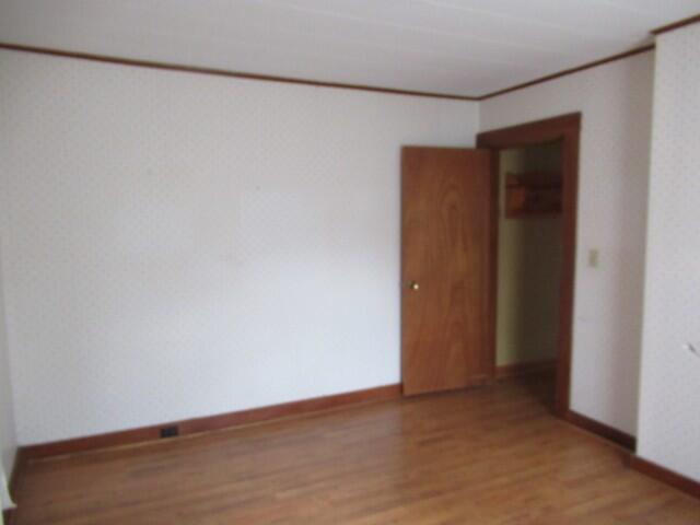 9 Norris Street Searsport, ME 04974 - Photo 18 of 29 16. 1st Floor Bedroom with laundry hook-