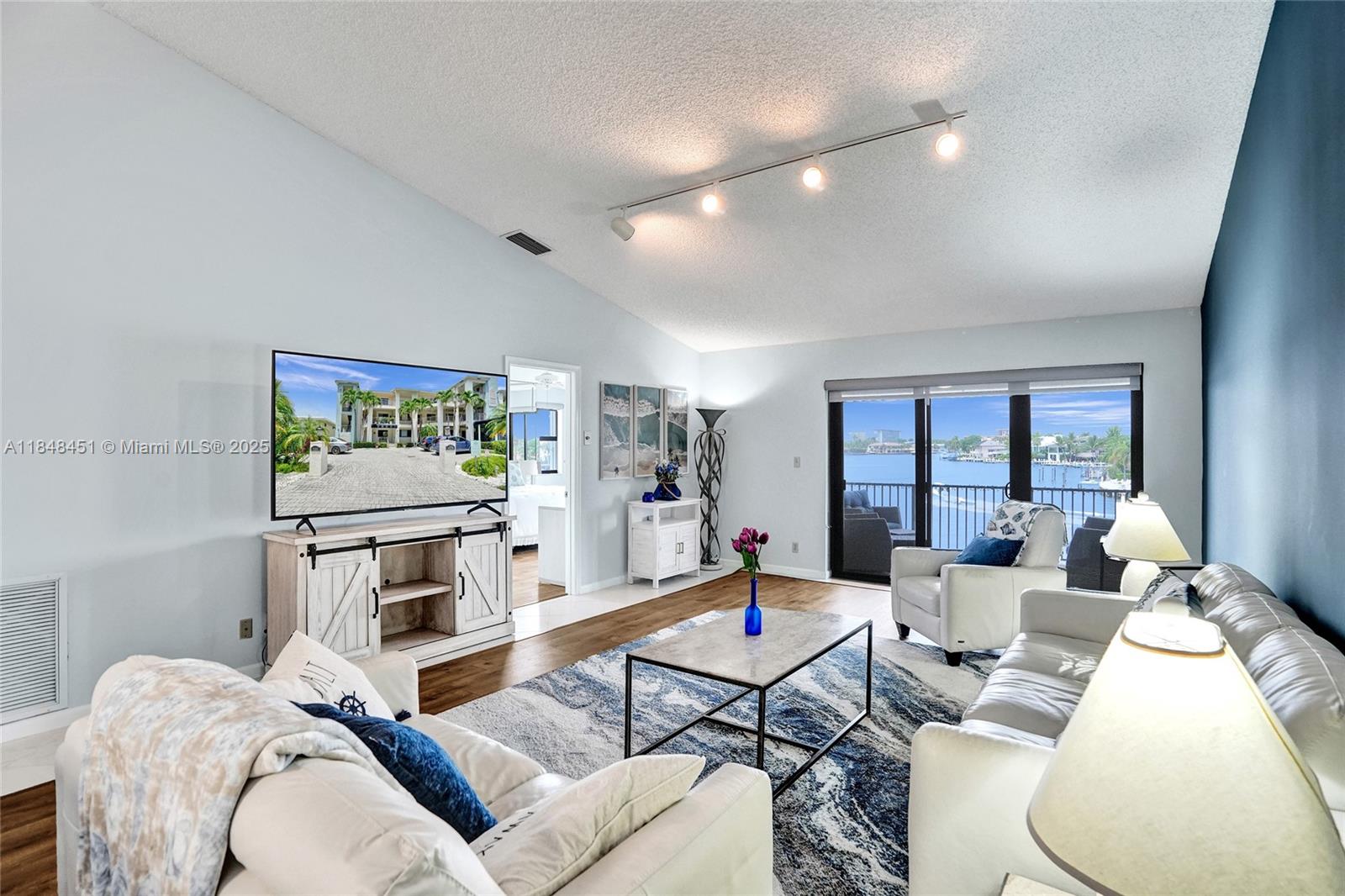 1101 South Riverside Drive, Unit 301 Pompano Beach, FL 33062 - Photo 12 of 40 a living room with furniture and a window
