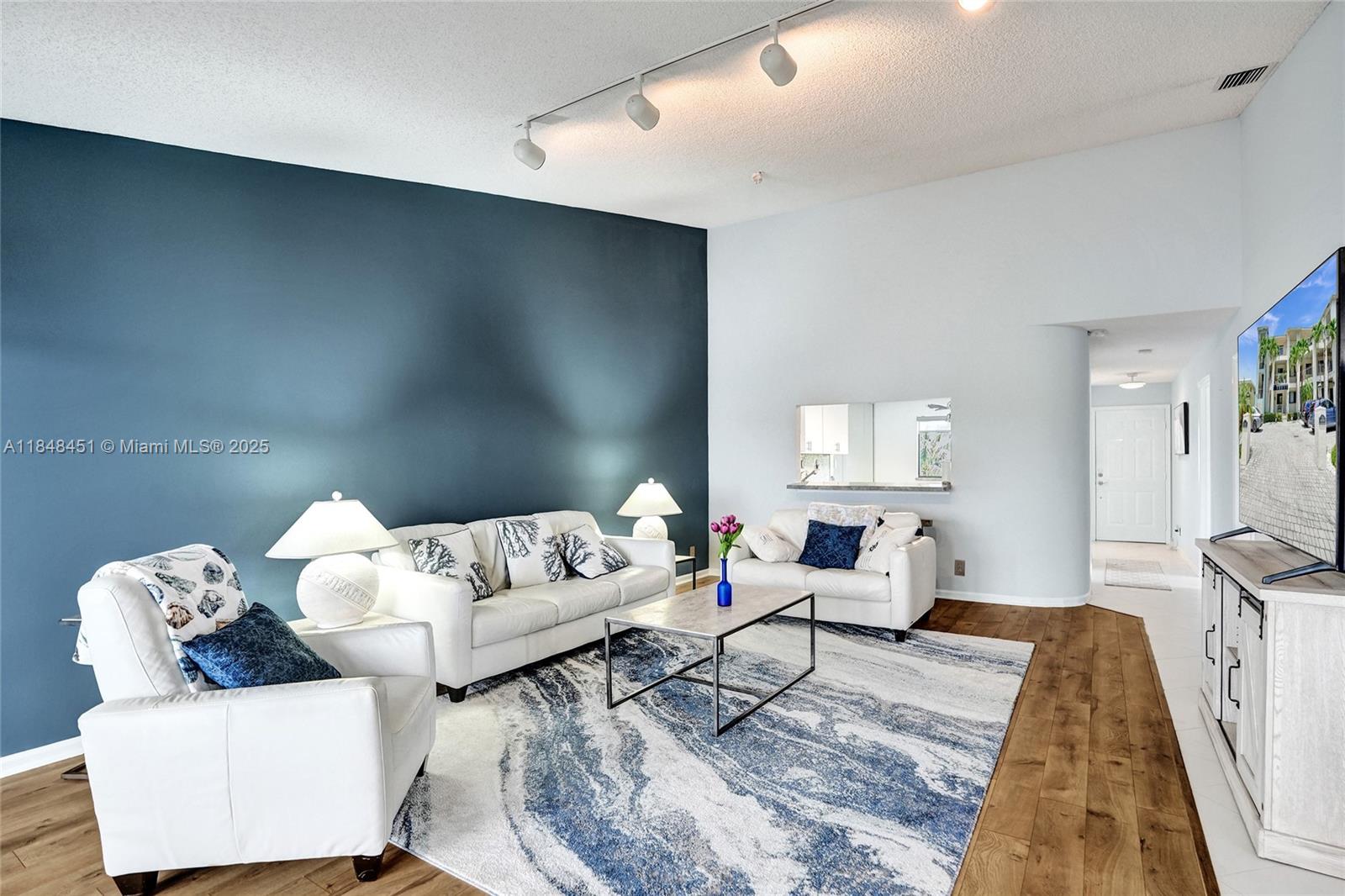 1101 South Riverside Drive, Unit 301 Pompano Beach, FL 33062 - Photo 14 of 40 a living room with furniture and a couch