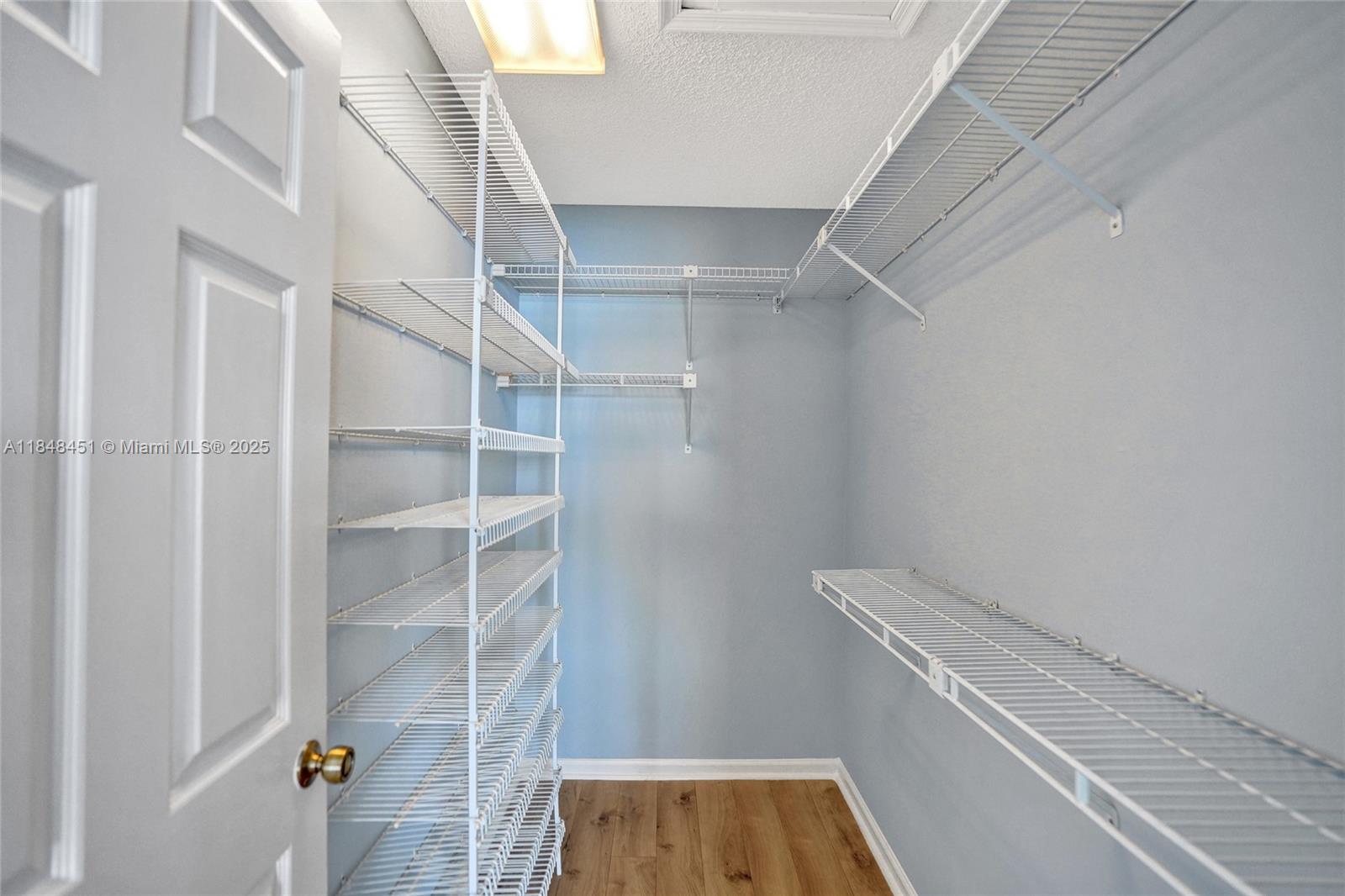 1101 South Riverside Drive, Unit 301 Pompano Beach, FL 33062 - Photo 22 of 40 a view of walk in closet with empty racks