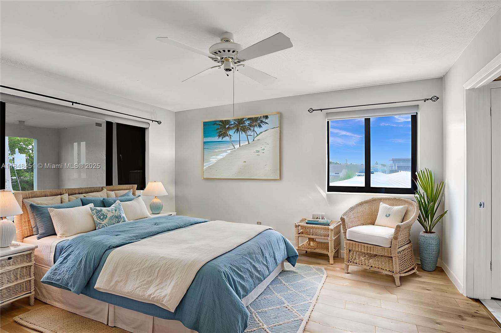 1101 South Riverside Drive, Unit 301 Pompano Beach, FL 33062 - Photo 24 of 40 a bedroom with a bed and wooden floor