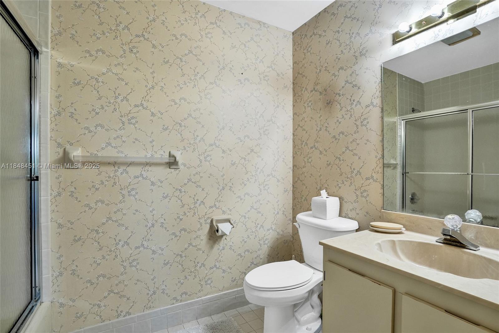 1101 South Riverside Drive, Unit 301 Pompano Beach, FL 33062 - Photo 25 of 40 a bathroom with a sink and a toilet