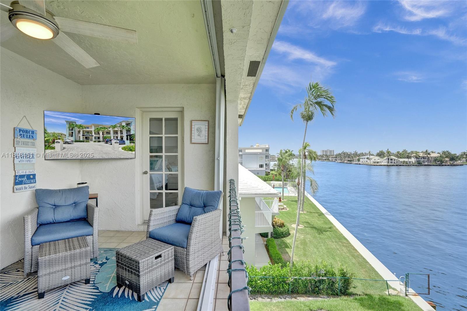 1101 South Riverside Drive, Unit 301 Pompano Beach, FL 33062 - Photo 26 of 40 a balcony with table and chairs
