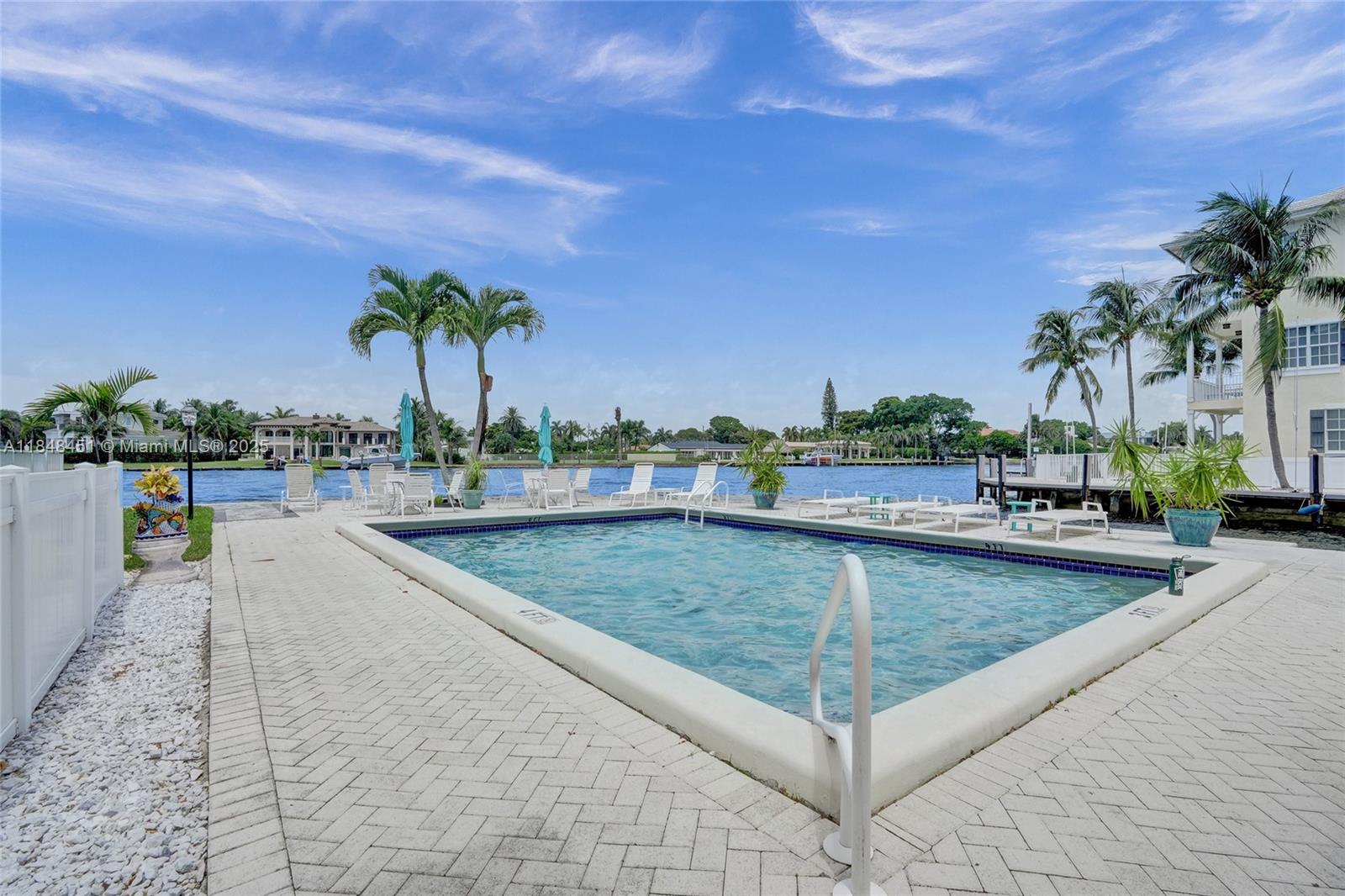 1101 South Riverside Drive, Unit 301 Pompano Beach, FL 33062 - Photo 28 of 40 a view of a swimming pool and a terrace