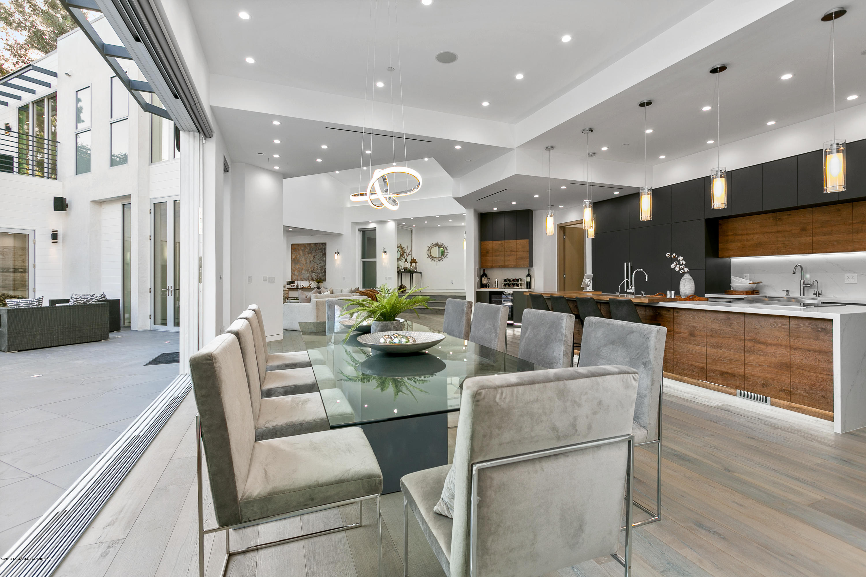 4402 Wasatch Drive La Canada Flintridge, CA 91011 - Photo 13 of 62 a dining room with kitchen island furniture and a view of kitchen