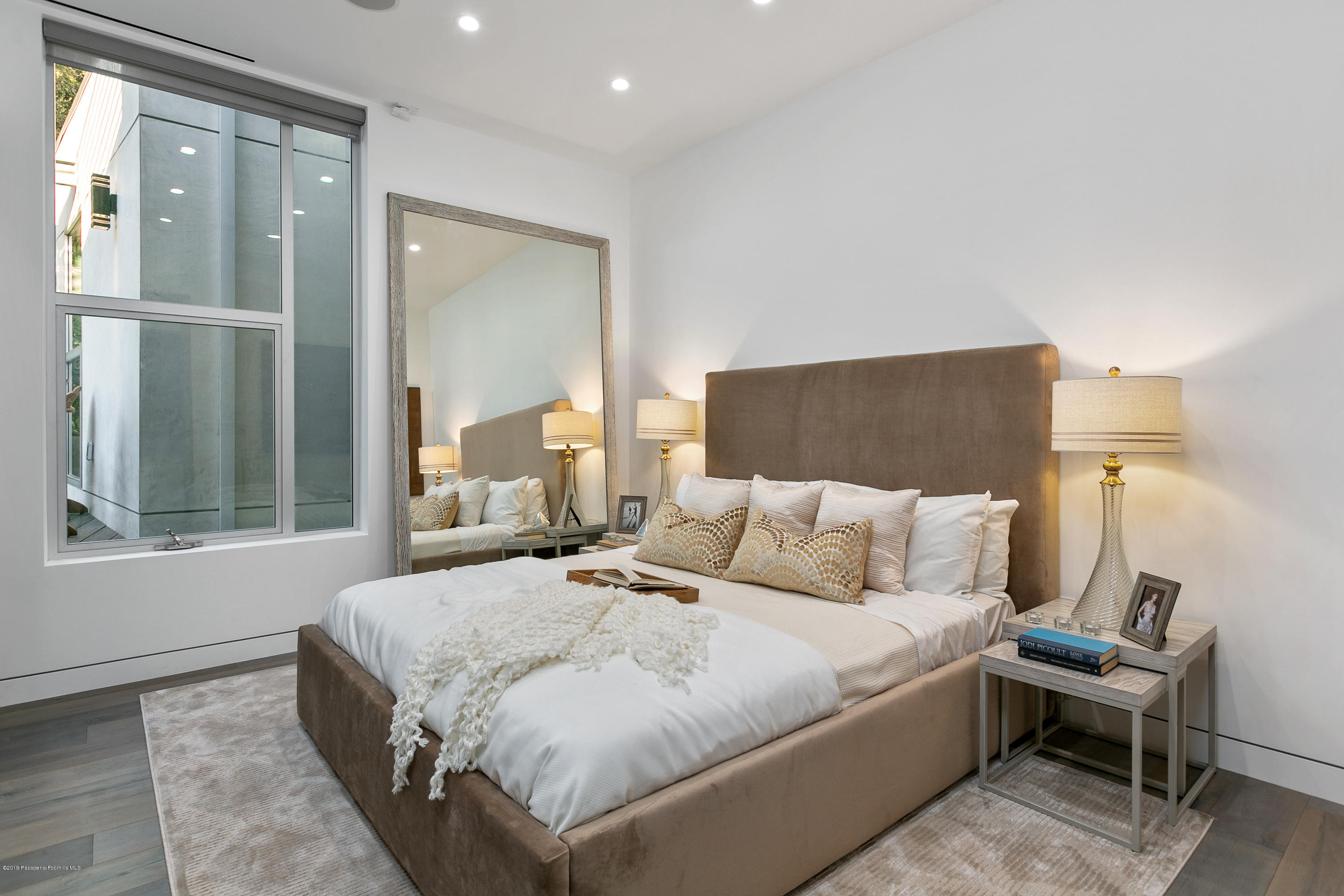 4402 Wasatch Drive La Canada Flintridge, CA 91011 - Photo 26 of 62 a bedroom with a bed and a large window