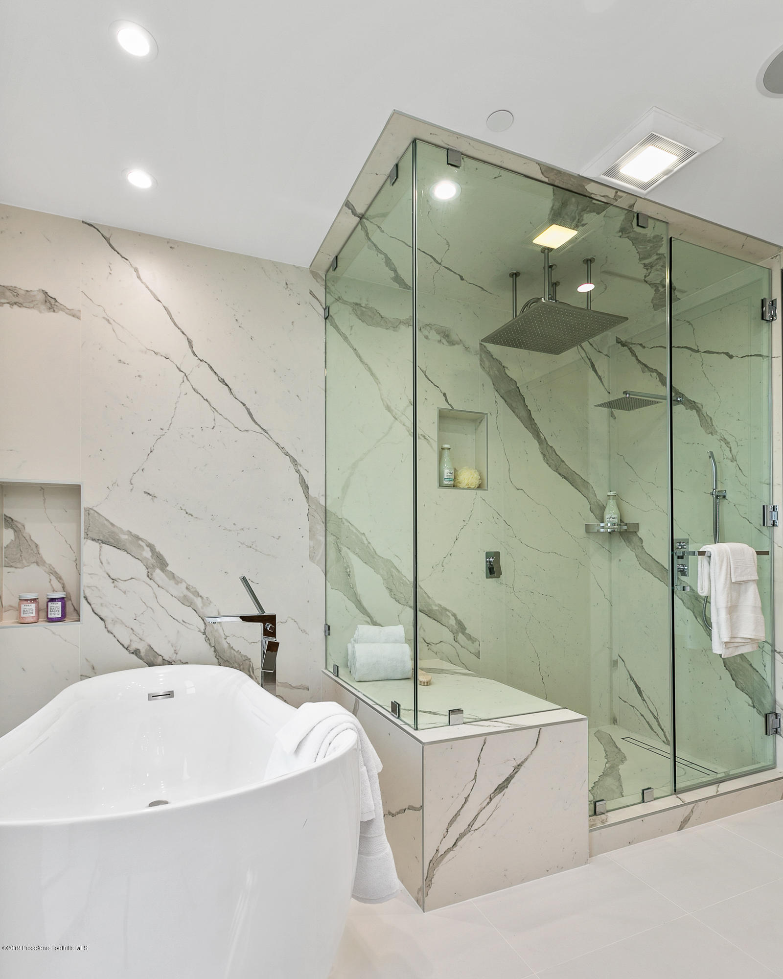 4402 Wasatch Drive La Canada Flintridge, CA 91011 - Photo 33 of 62 a bathroom with a white bath tub sitting next to shower and a sink