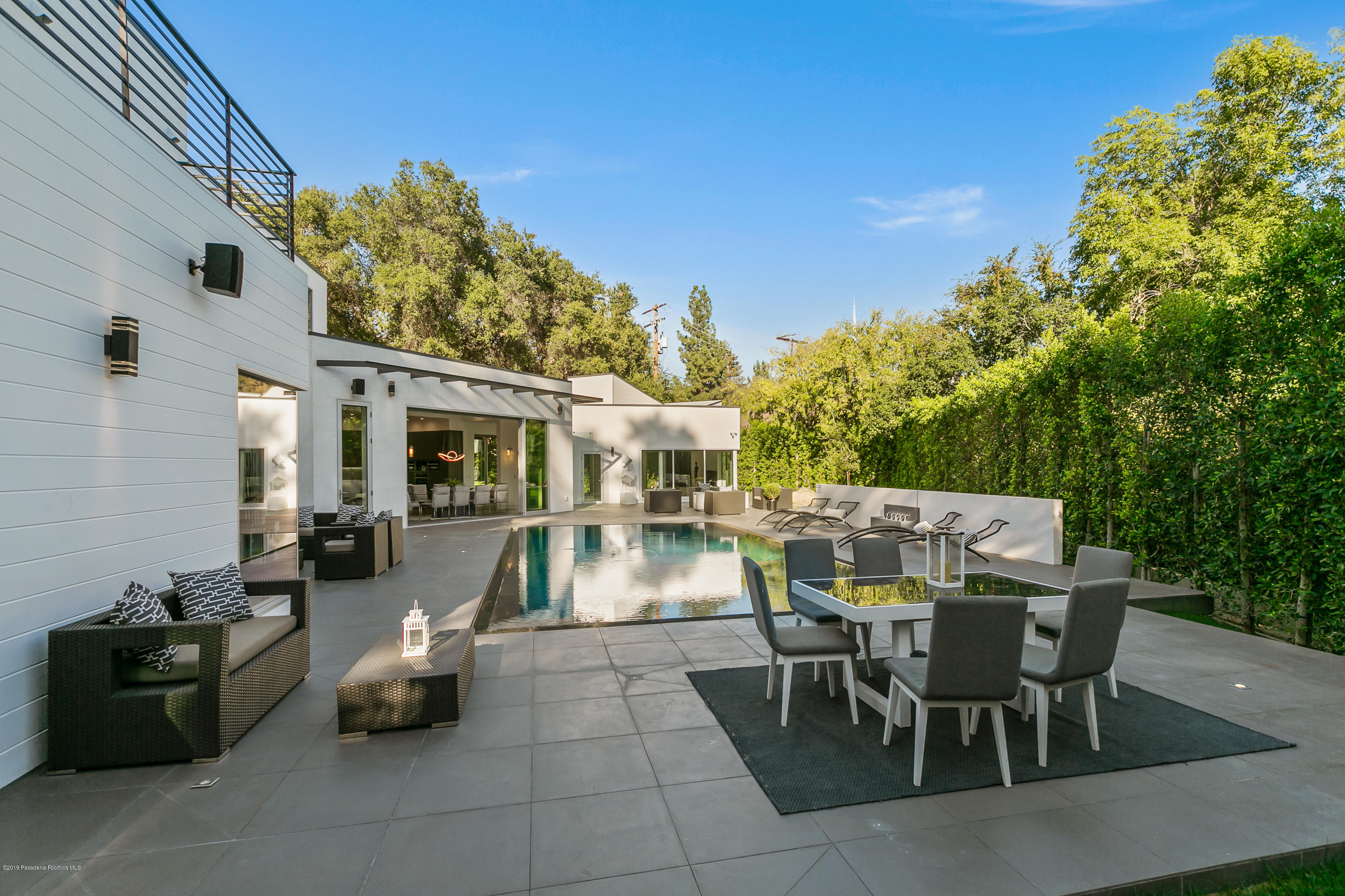 4402 Wasatch Drive La Canada Flintridge, CA 91011 - Photo 36 of 62 a view of a patio with dining table and chairs with plants