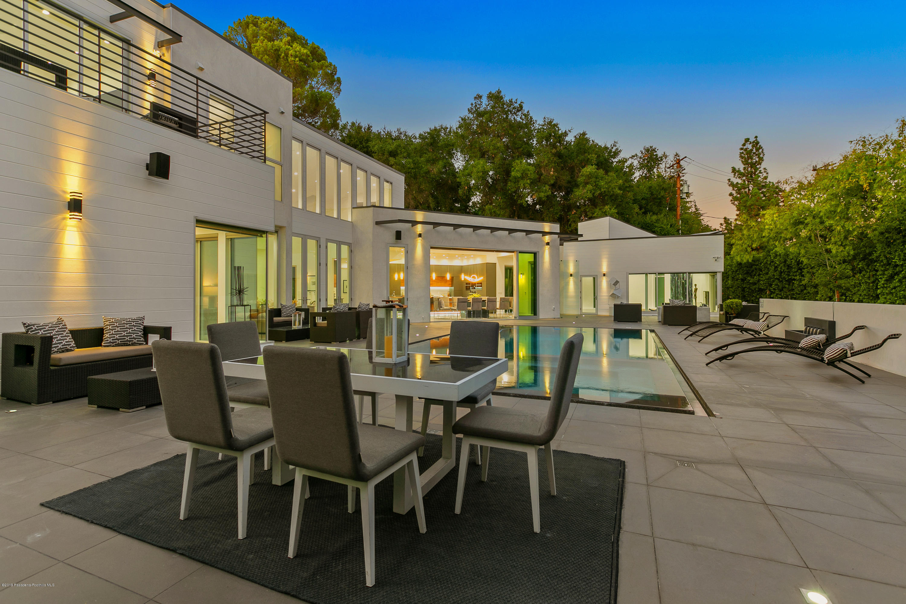 4402 Wasatch Drive La Canada Flintridge, CA 91011 - Photo 43 of 62 a view of a patio with couches table and chairs and potted plants
