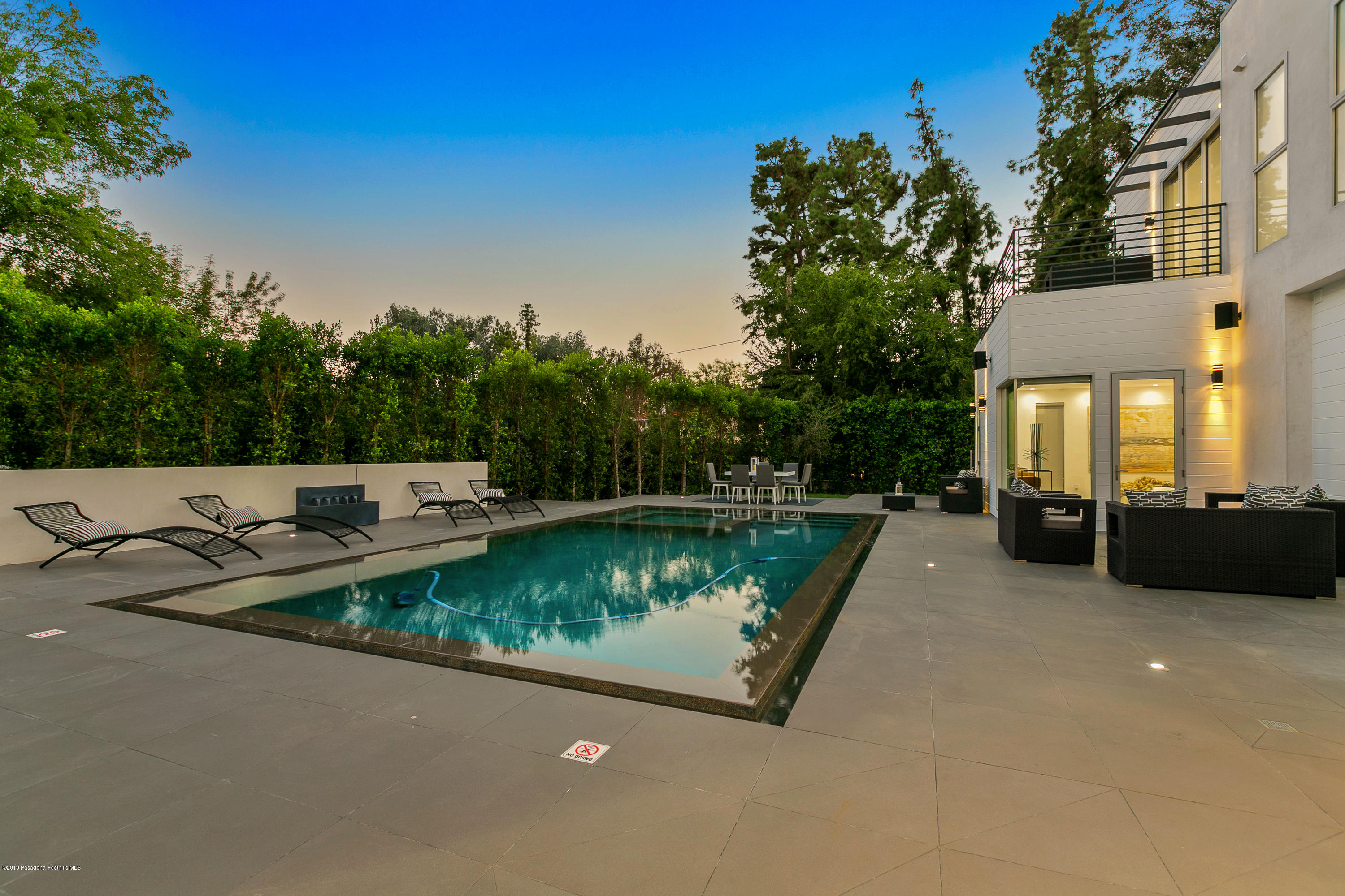 4402 Wasatch Drive La Canada Flintridge, CA 91011 - Photo 44 of 62 a view of a patio with chairs a barbeque with wooden fence