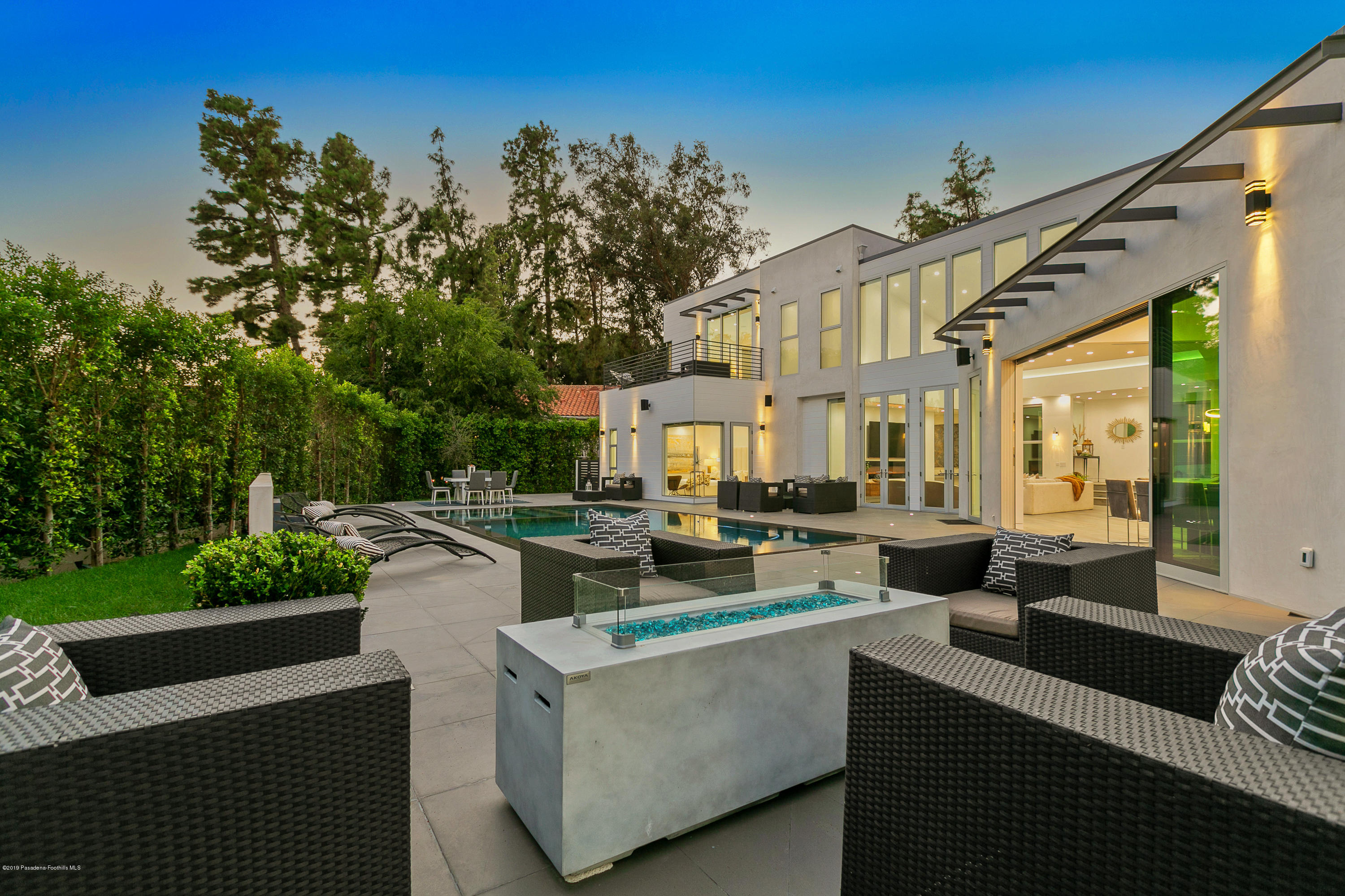 4402 Wasatch Drive La Canada Flintridge, CA 91011 - Photo 45 of 62 a view of a patio with couches table and chairs with potted plants