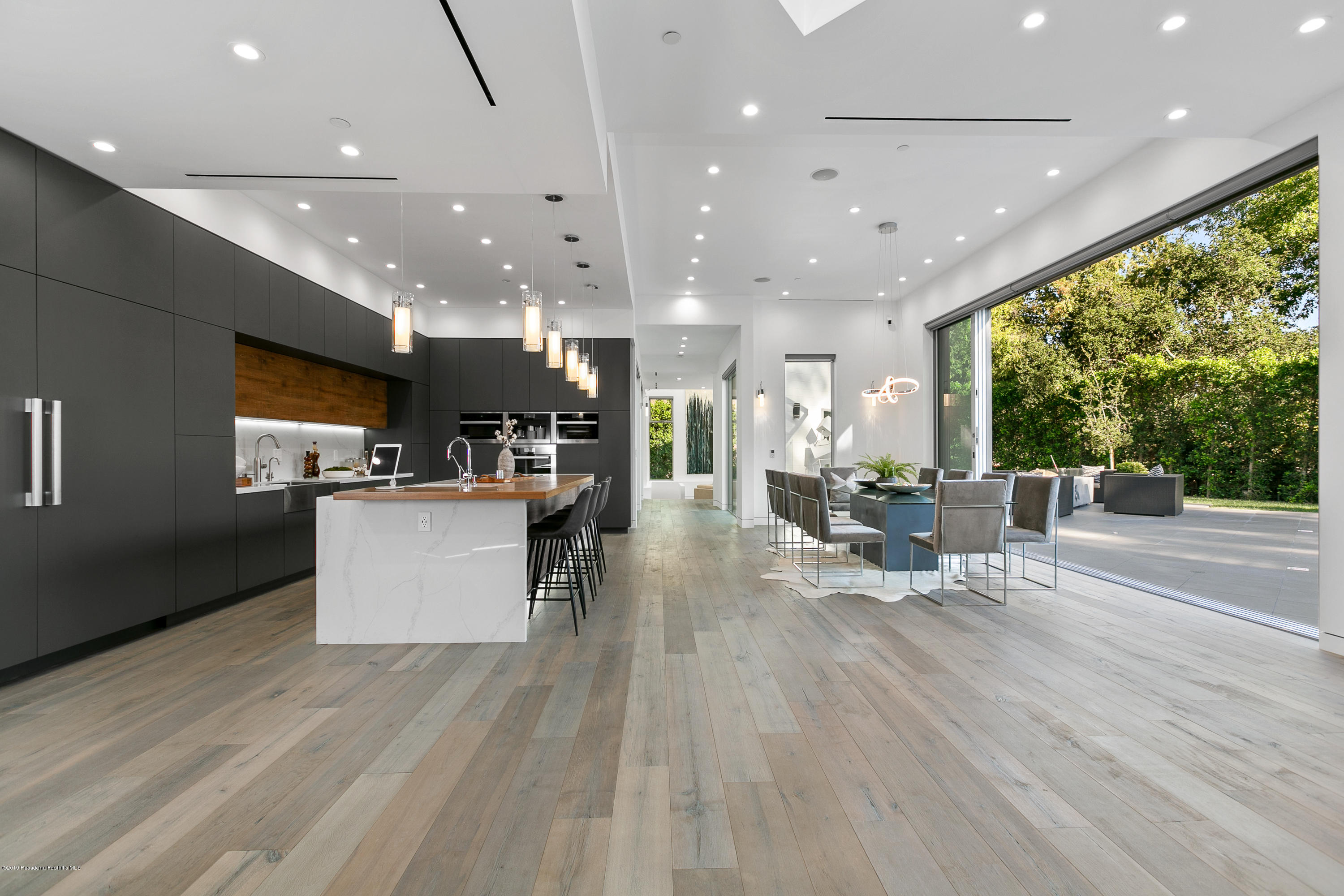 4402 Wasatch Drive La Canada Flintridge, CA 91011 - Photo 8 of 62 a large kitchen with stainless steel appliances kitchen island a large island in the center