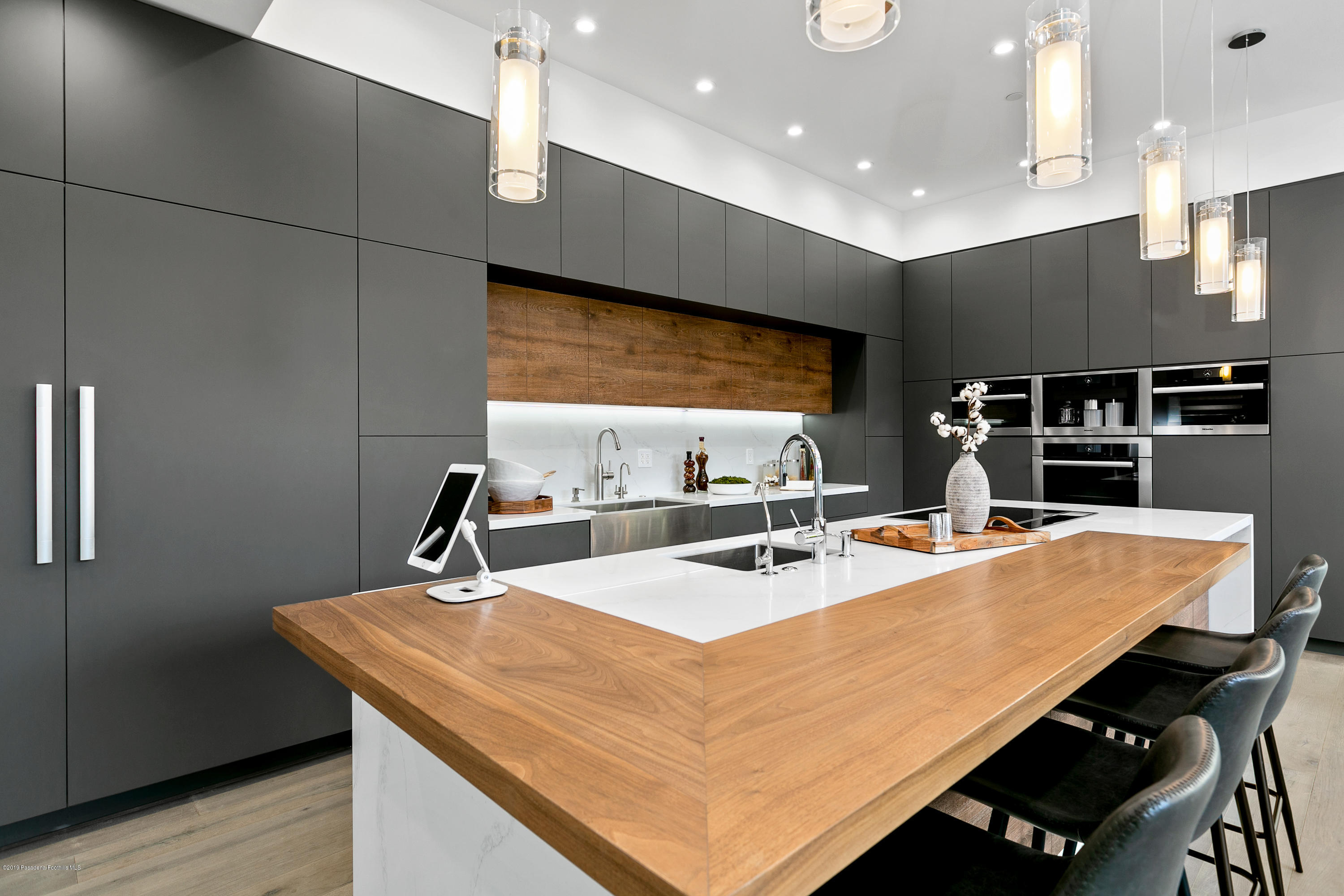 4402 Wasatch Drive La Canada Flintridge, CA 91011 - Photo 9 of 62 a kitchen with kitchen island a sink appliances and a counter top space