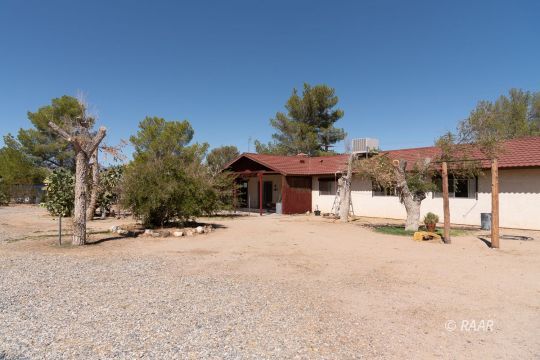 2109 West Ridgecrest Boulevard Ridgecrest, CA 93555 - Photo 30 of 35 a view of a house with a park