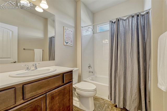 3203 Red Cavern Road Colorado Springs, CO 80908 - Photo 18 of 46 Main level full secondary bathroom with fresh, clean design