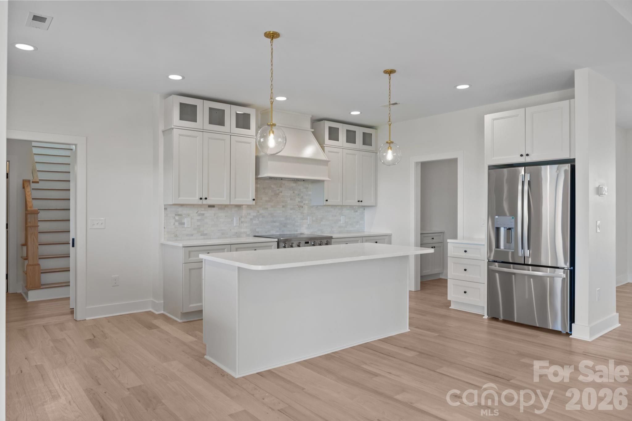4805 Patterson Road China Grove, NC 28023 - Photo 19 of 42 a kitchen with kitchen island a sink stainless steel appliances and cabinets