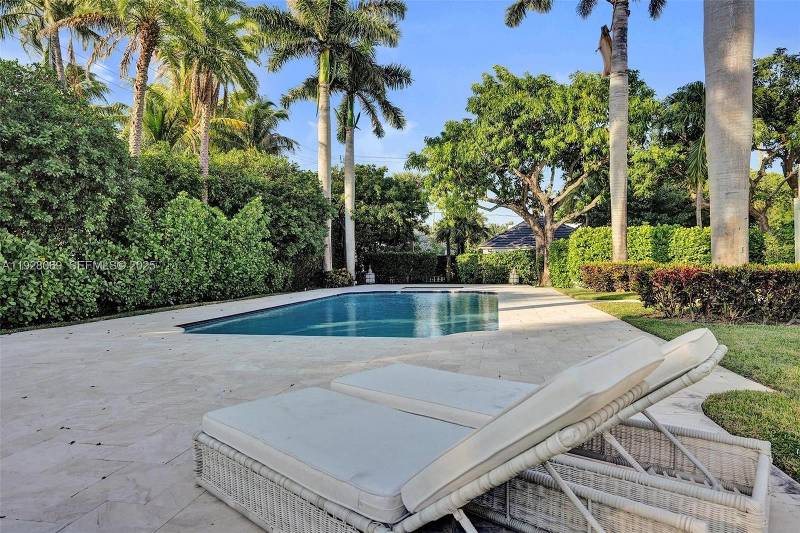 1281 Banyan Road Boca Raton, FL 33432 - Photo 25 of 69 a view of a backyard and a swimming pool