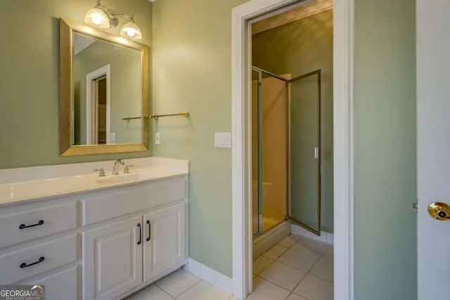 a bathroom with a shower and a mirror