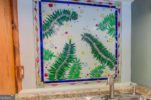 a front view of a house with a garden and plants