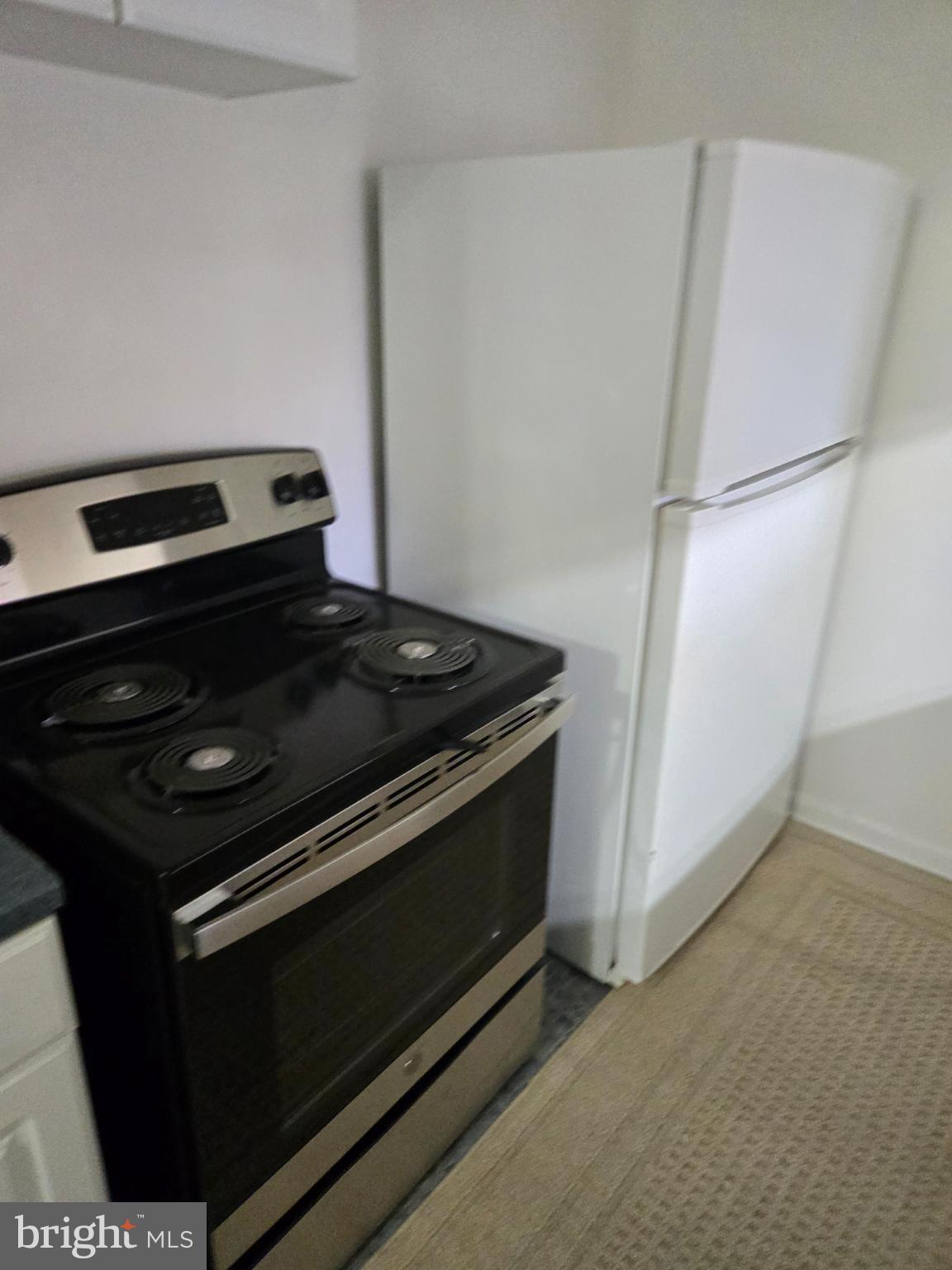 401 O Street Northwest Washington, DC 20001 - Photo 14 of 41 a stove top oven sitting inside of a kitchen