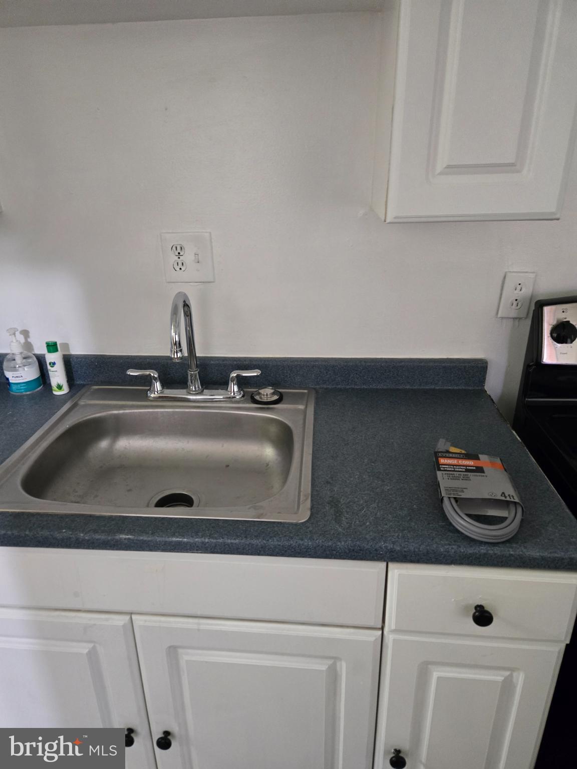 401 O Street Northwest Washington, DC 20001 - Photo 15 of 41 a kitchen with sink a cabinets and appliances
