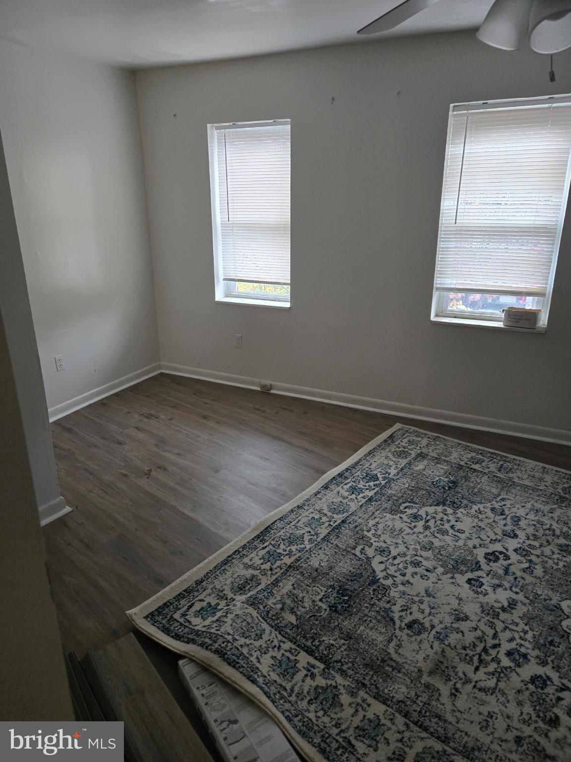 401 O Street Northwest Washington, DC 20001 - Photo 29 of 41 an empty room with wooden floor cabinet and windows