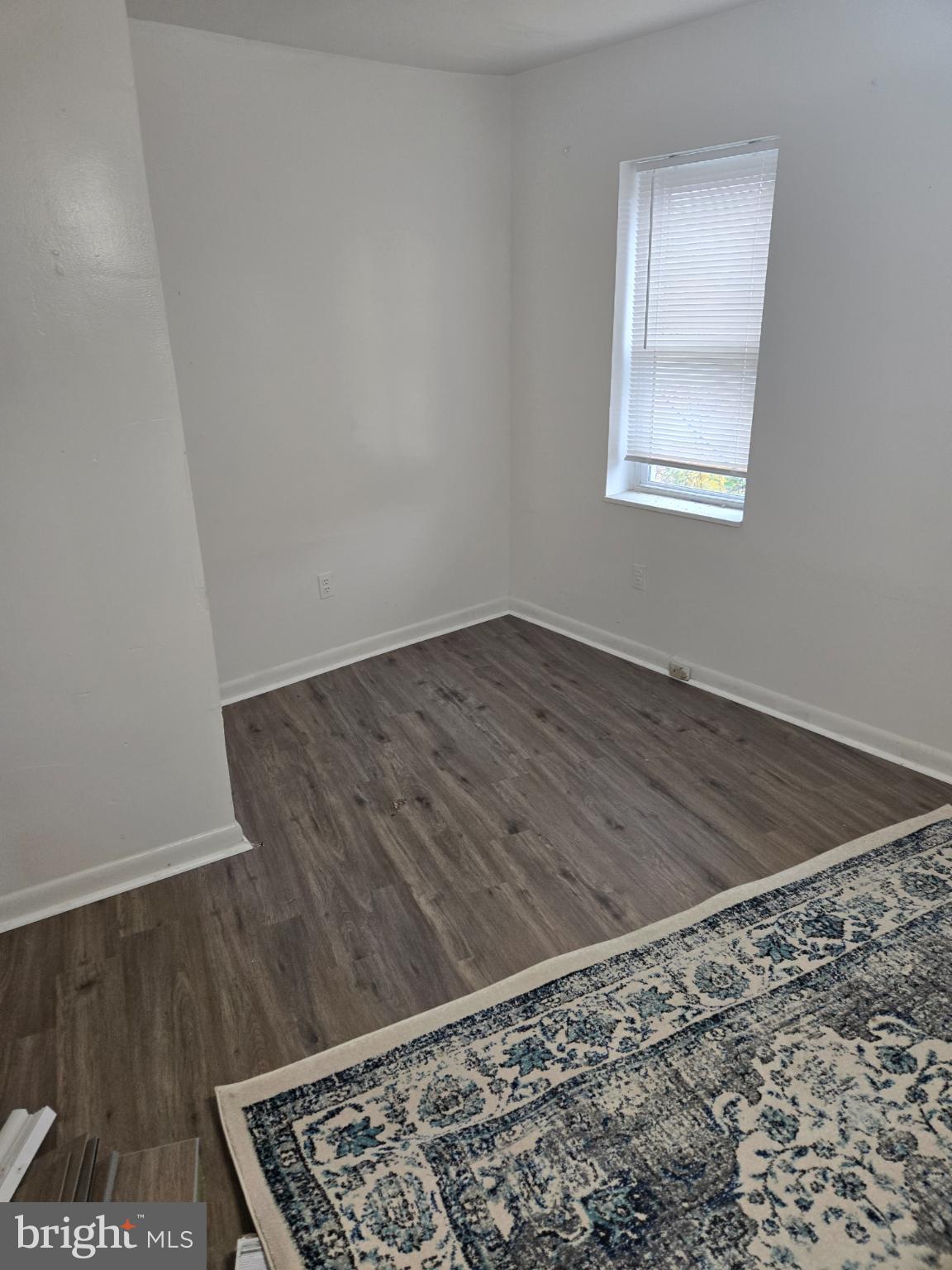 401 O Street Northwest Washington, DC 20001 - Photo 31 of 41 an empty room with wooden floor and a window