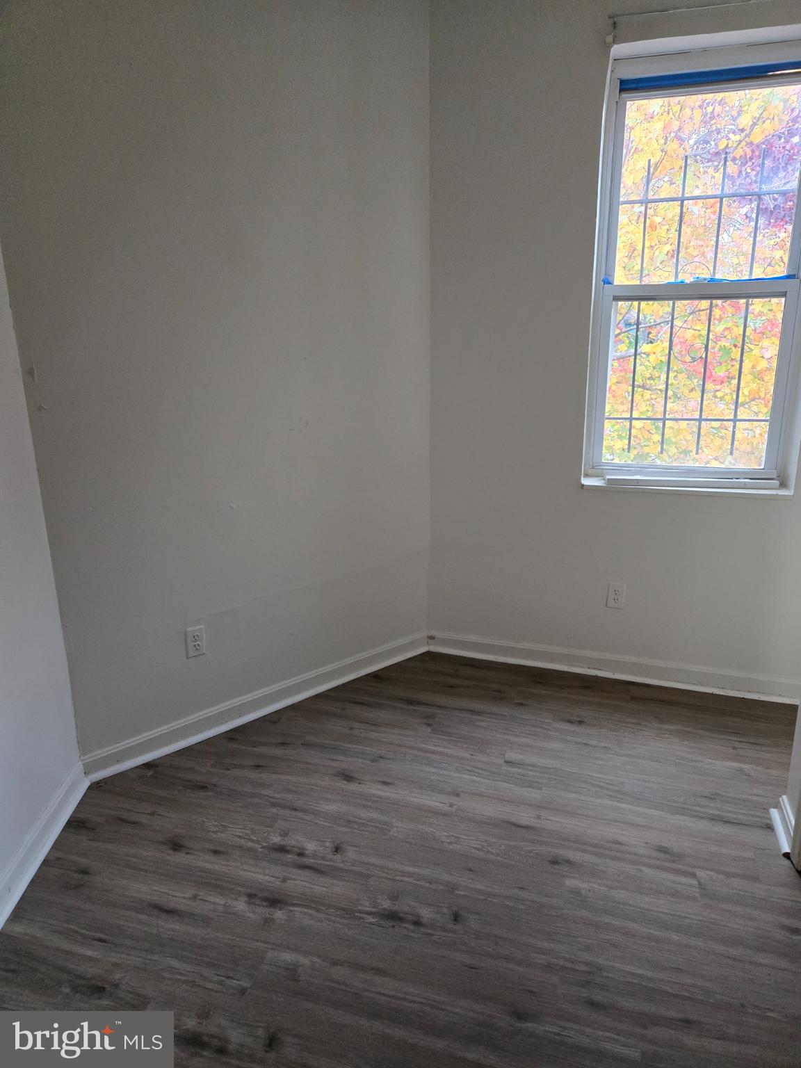 401 O Street Northwest Washington, DC 20001 - Photo 36 of 41 a view of an empty room with wooden floor and a window