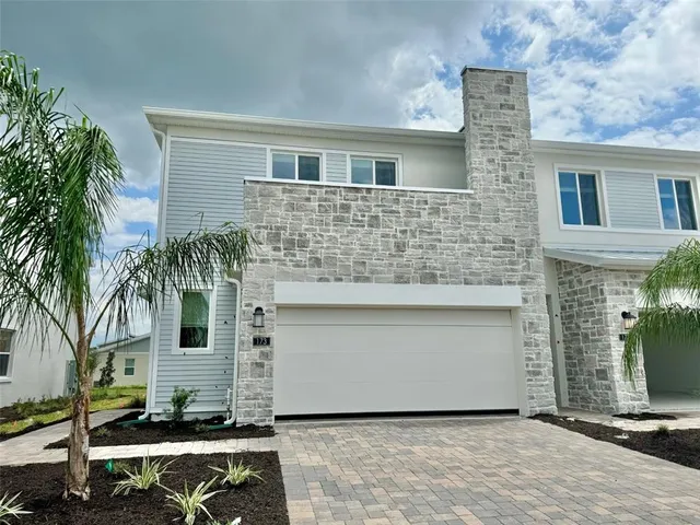 a front view of a house with yard