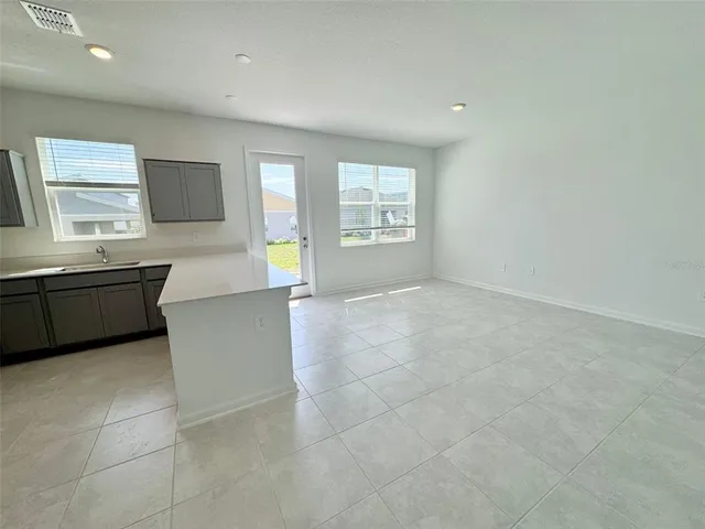 a view of kitchen with windows