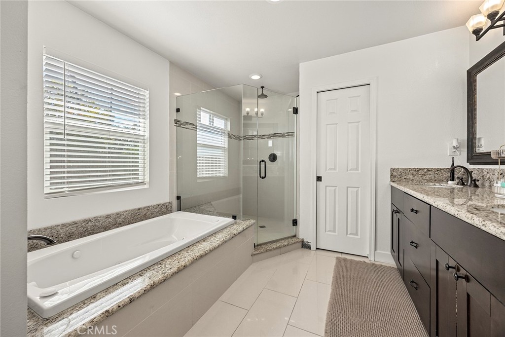 15914 West Road Whittier, CA 90603 - Photo 26 of 47 a spacious bathroom with a granite countertop tub shower and a sink