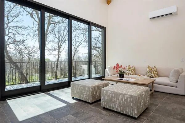 a living room with couch and a large window
