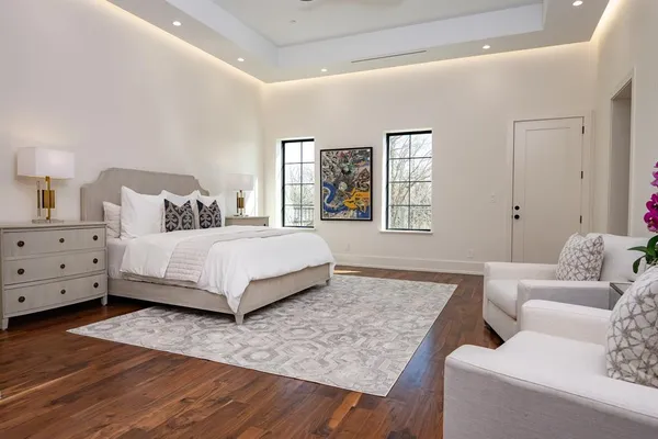 a bedroom with a bed and a couch